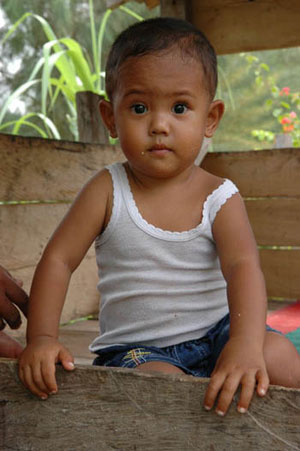 young child wearing white shirt