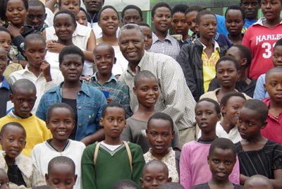 Dr. Mbanda surrounded by children