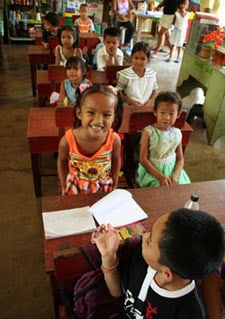 Several young children in a classroom.