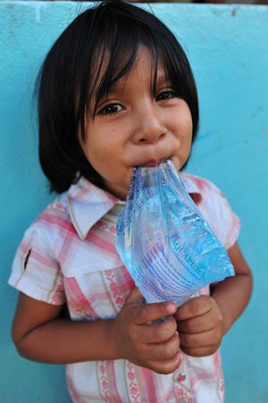 girl with bag of water