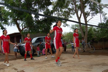 group of children playing volleyball