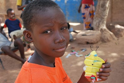 Young child holding a toy.