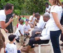 children washing the feet of elders