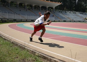 boy running on track