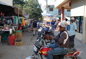 street scene with man on a motorbike
