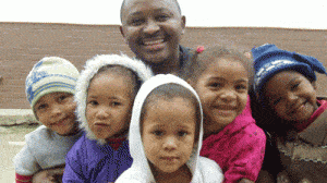 Jimmy Wambua with group of children
