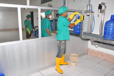 men working in a water purification plant