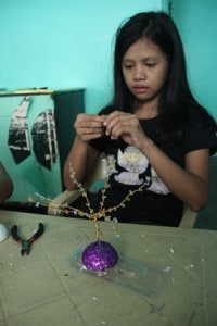 girl working on a craft