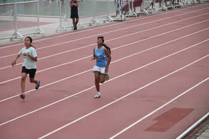 two girls competing in track meet