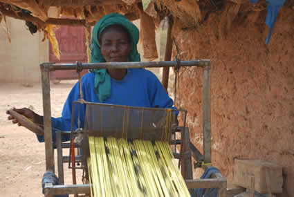 woman weaving on a loom