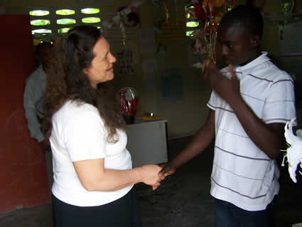 woman shaking hands with a young man