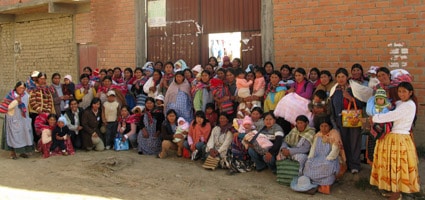 group of Bolivian adults and children posing for photo