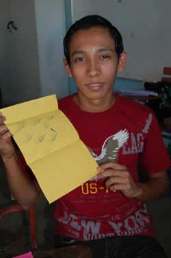 young man holding a letter