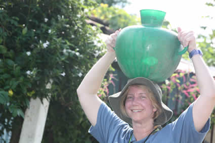 woman carrying water jug on head