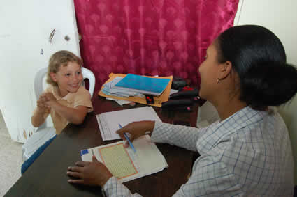 woman and young boy with letter