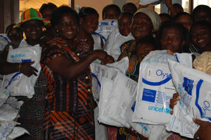 group of Ghanaian people holding mosquito nets