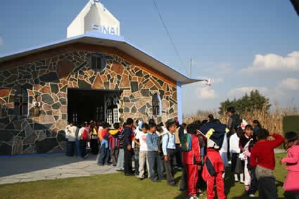 group of children lined up outside a church