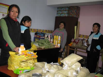 group of women packing bags of groceries
