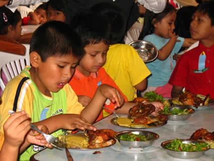 group of children enjoying a meal