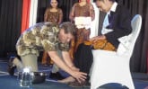 Wess Stafford washes the feet of a Leadership Development Program graduate.