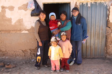 three women and three children posing for photo