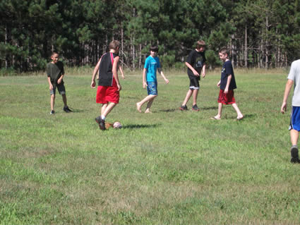 group of boys kicking a ball