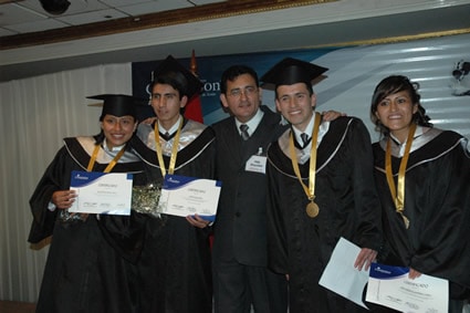 four youth in caps and gowns and holding diplomas