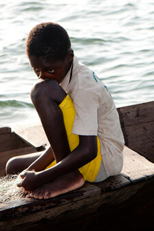 boy sitting in a boat