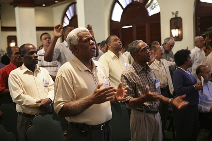 group of adults worshipping in church