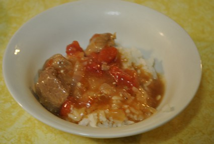 a bowl of stew over rice