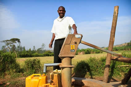 man standing by Living Water project