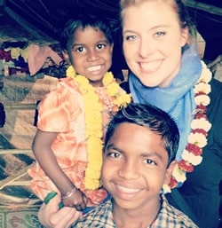 Rachel Mueller with two children in India