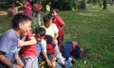 Boys playing San Pirutejo in Ecuador