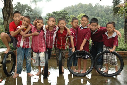 group of boys with tires