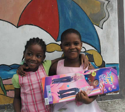 Two children holding a toy