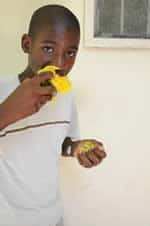 boy eating a mango