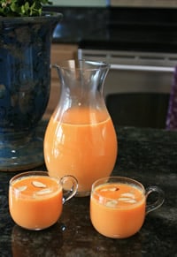 pitcher and two cups of juice
