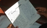 child holding letter IN