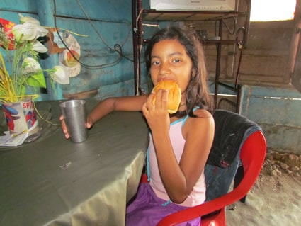 girl eating piece of bread