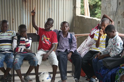 boy sitting with classmates