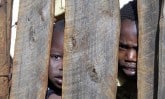 children behind fence_KE