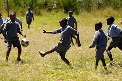 Sponsored children playing soccer in Kenya