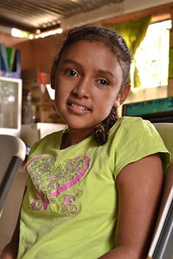 A Nicaraguan girl wearing a yellow shirt
