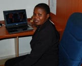 person sitting at desk with laptop