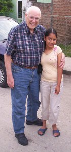 James Boer standing with arm around girl