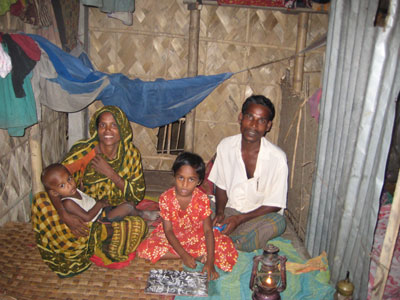 family sitting on the floor inside a home