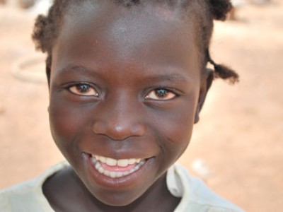 Young child smiling.