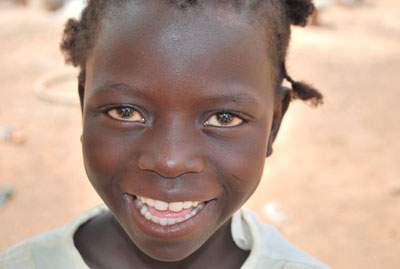 Young child smiling.