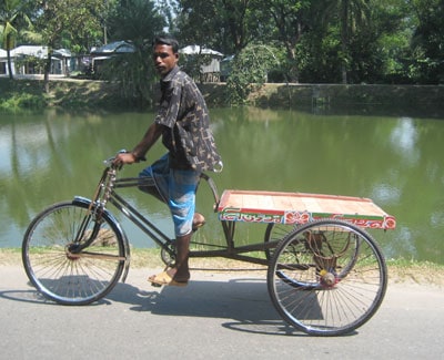 young man riding cargo bicycle