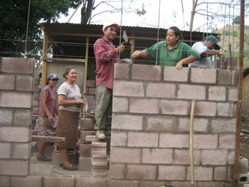 people constructing home in El Salvador